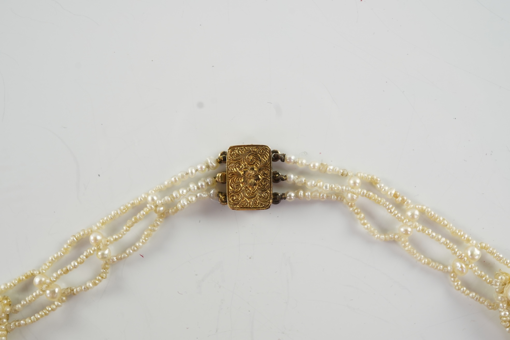 A Regency seed pearl necklace, brooch and pair of earrings, early 19th century